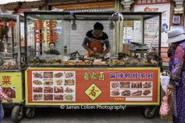 Meat trader at the street market in Lhasa, Tibet, China