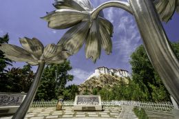 Flower sculptures with view of Potala Palace in Lhasa, Tibet, China