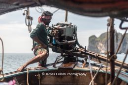 Fisherman guiding his speedboat near Krabi, Thailand