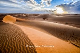 Sunset over Al Wasil sand dunes, Oman
