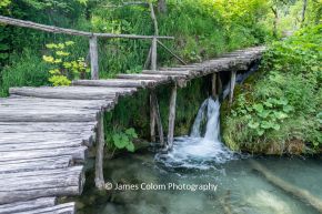 Waterfall under the walkway at Plitvice Lakes National Park, Croatia