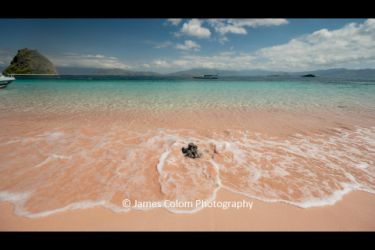 Pink Sand Beach with Gentle Waves in Komodo Islands National Park, Indoensia