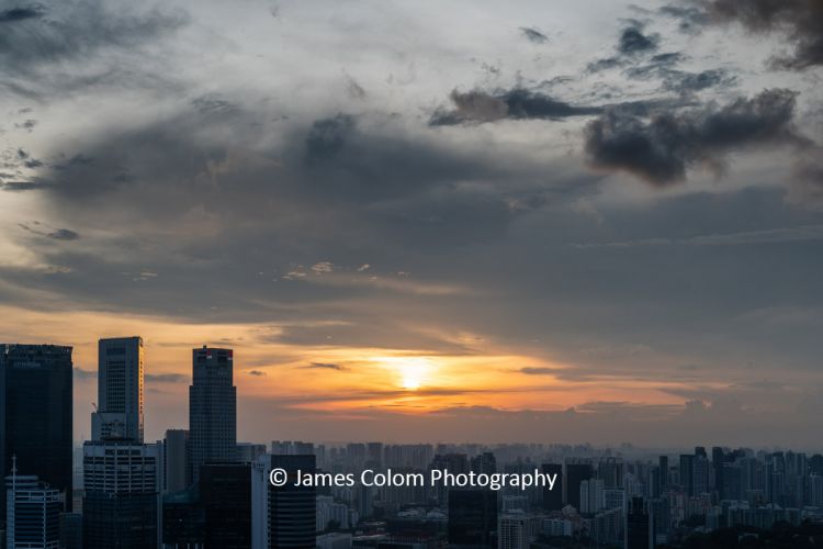 Sunset over Singapore Skyline from the top of Marina Bay Sands, Singapore